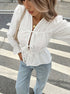 White puff sleeve blouse with tie front and V-neck for women