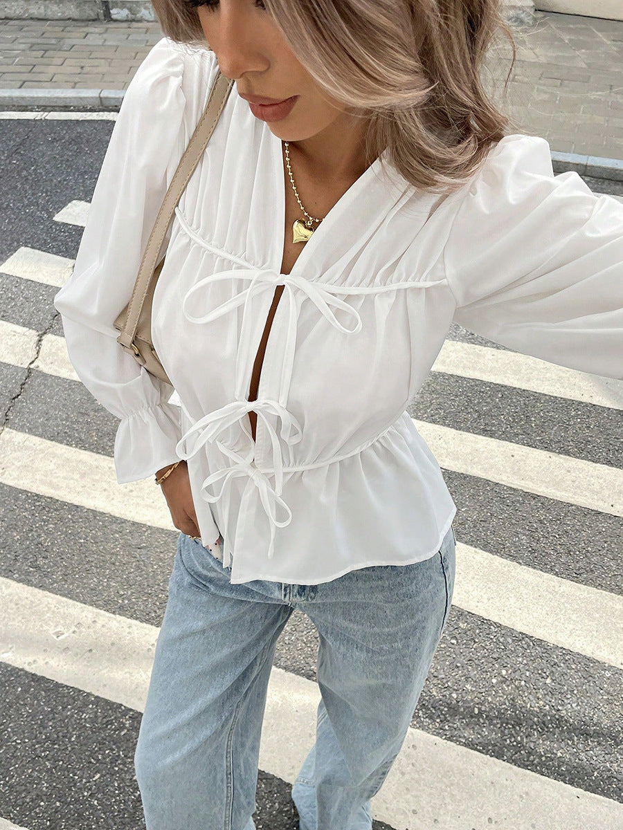 White puff sleeve blouse with tie front and V-neck for women
