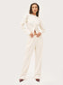 white ribbed co ord set worn by model standing pose