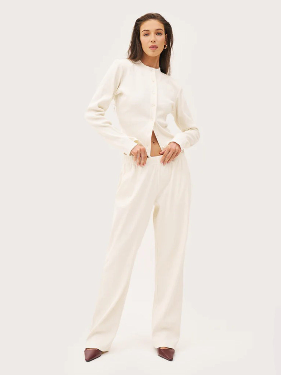 white ribbed co ord set worn by model standing pose