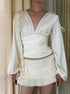 White satin top with ruched waist and V-neck front view