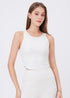 White sleeveless workout tank with ruched sides for yoga and gym