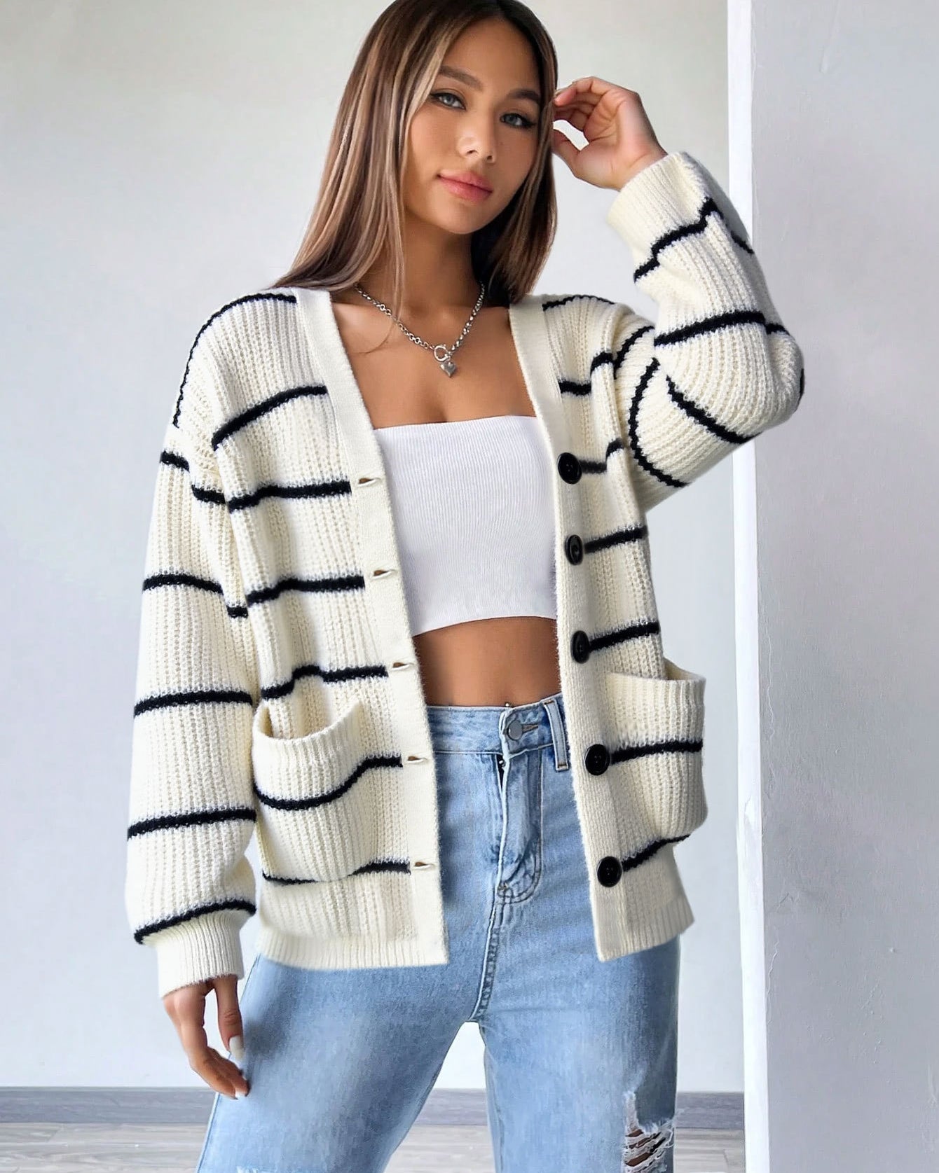 white striped cardigan casual outfit with jeans