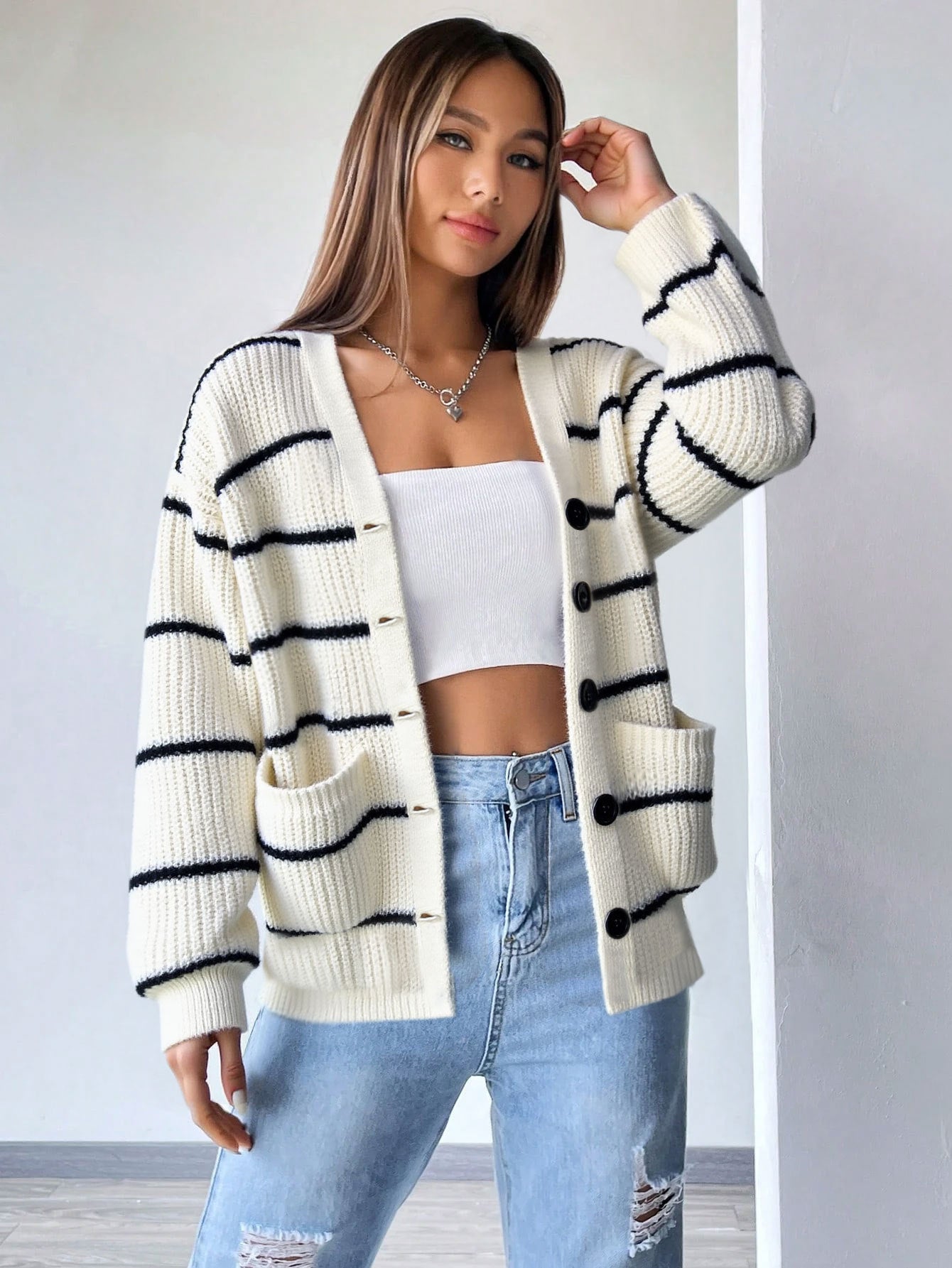 white striped cardigan casual outfit with jeans