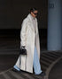 White teddy lapel coat, parking lot scene, layered with denim
