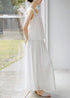 Side angle of white flowy two piece skirt set