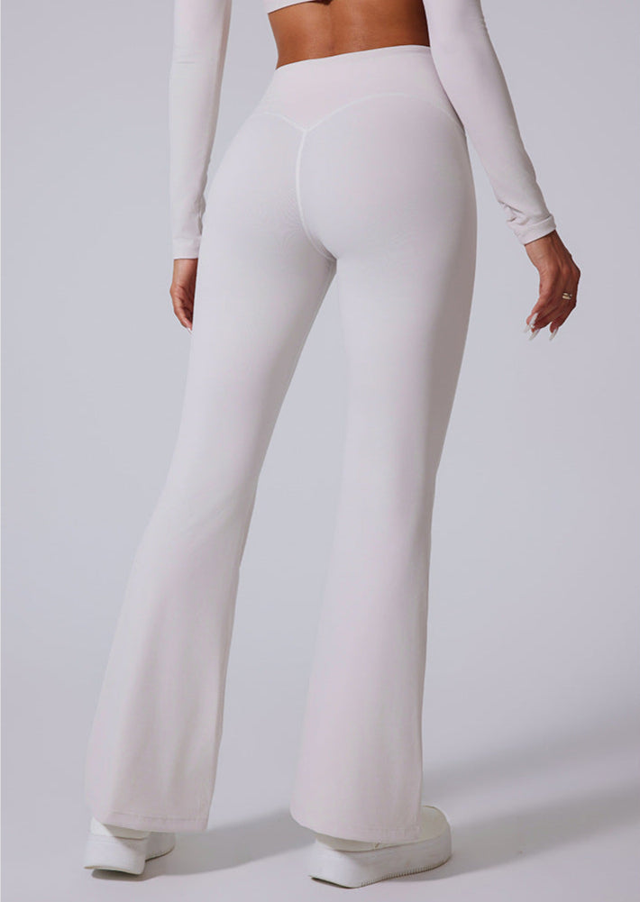 Back view of white high waisted wide leg flare leggings