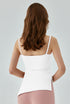 Back view of white yoga tank top with asymmetrical hem.