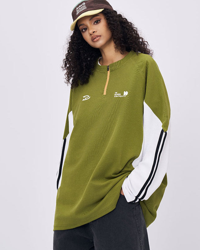 Woman wearing green retro contrast color long sleeve t-shirt casual streetwear look