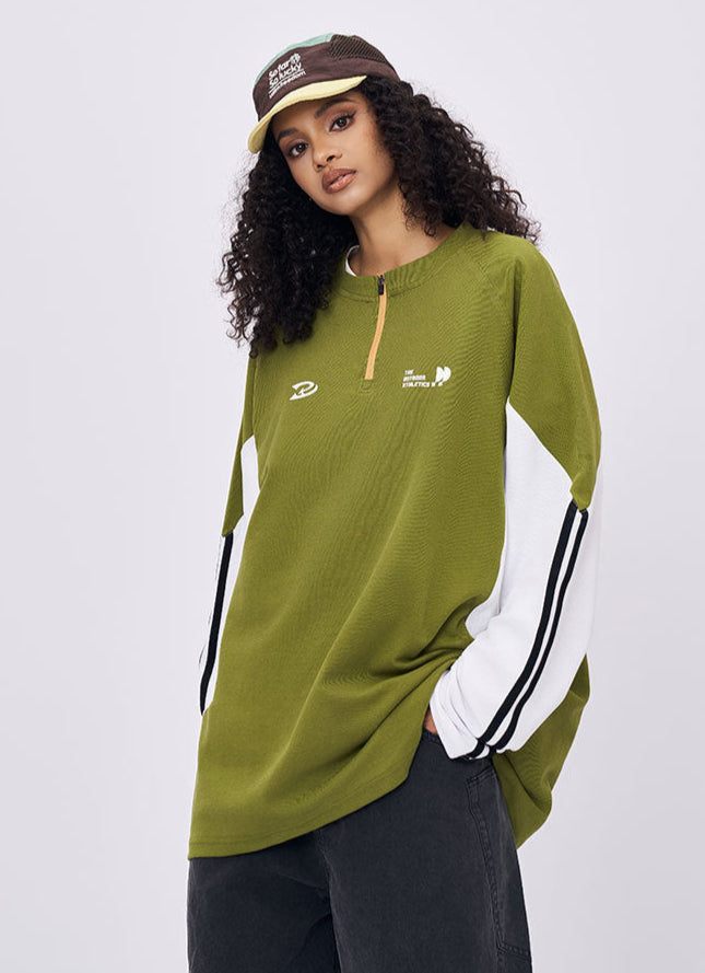 Woman wearing green retro contrast color long sleeve t-shirt casual streetwear look