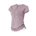 Lavender athletic top with side ruched detail and front zip closure.