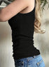 Side view of women’s black camisole top with lace trim and ribbed fabric