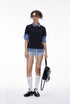 Women’s black layered polo shirt with plaid sleeves, oversized back-to-school layered outfit