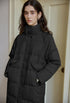 Black long puffer coat with high collar and quilted panels