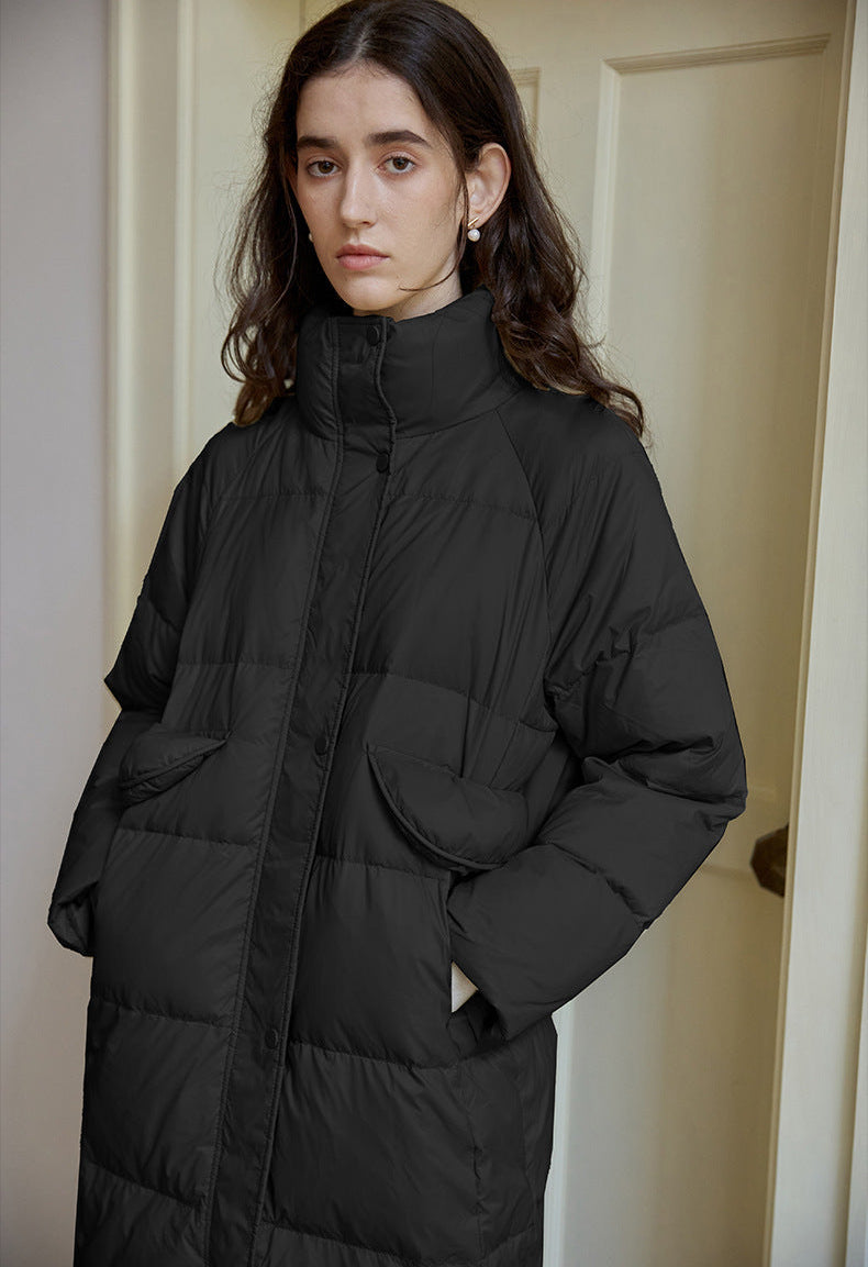 Black long puffer coat with high collar and quilted panels