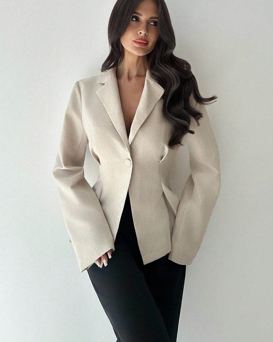 women’s beige blazer, slim fit one-button lapel, front 3/4 with black trousers