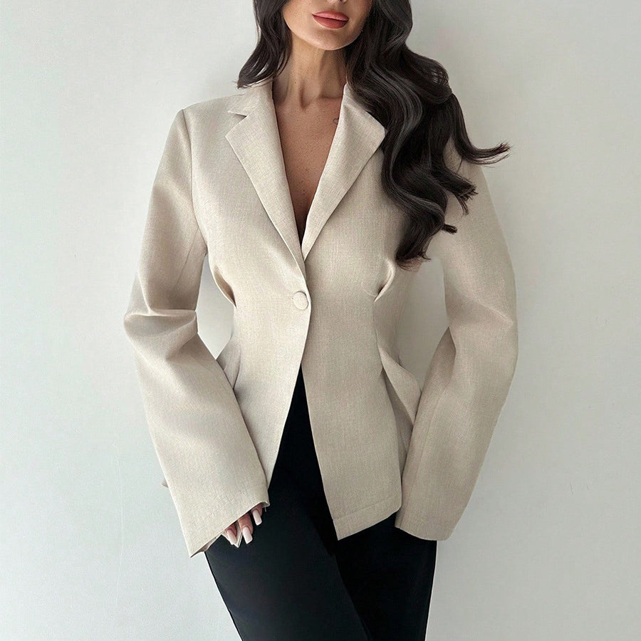 women’s beige blazer, slim fit one-button lapel, front 3/4 with black trousers
