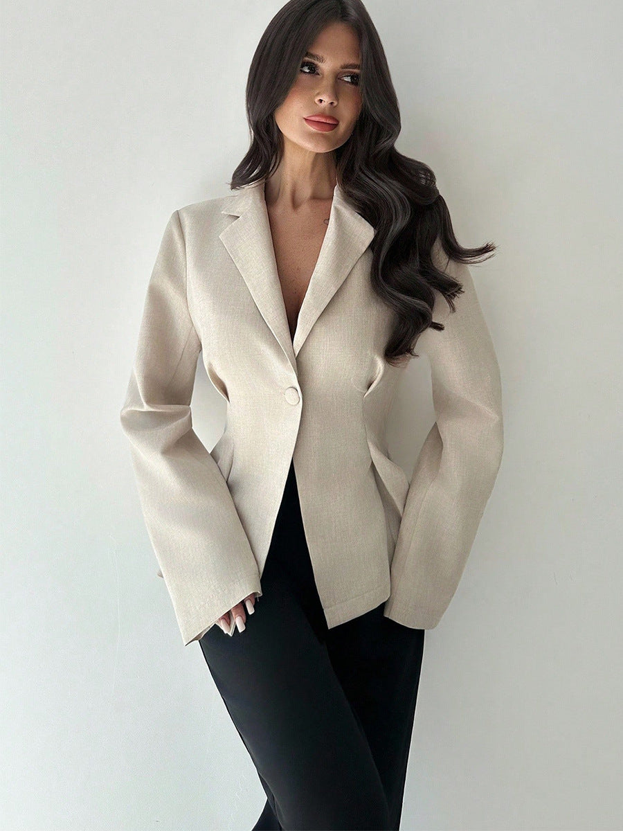 women’s beige blazer, slim fit one-button lapel, front 3/4 with black trousers