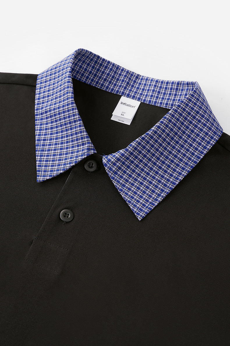 Close-up of blue plaid collar detail on women’s layered black polo shirt, preppy campus streetwear style