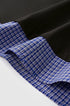 Close-up of hem detail on women’s layered long sleeve polo shirt with plaid sleeves, casual streetwear top