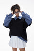 Women’s oversized layered polo t-shirt in black with plaid sleeves, casual school streetwear look