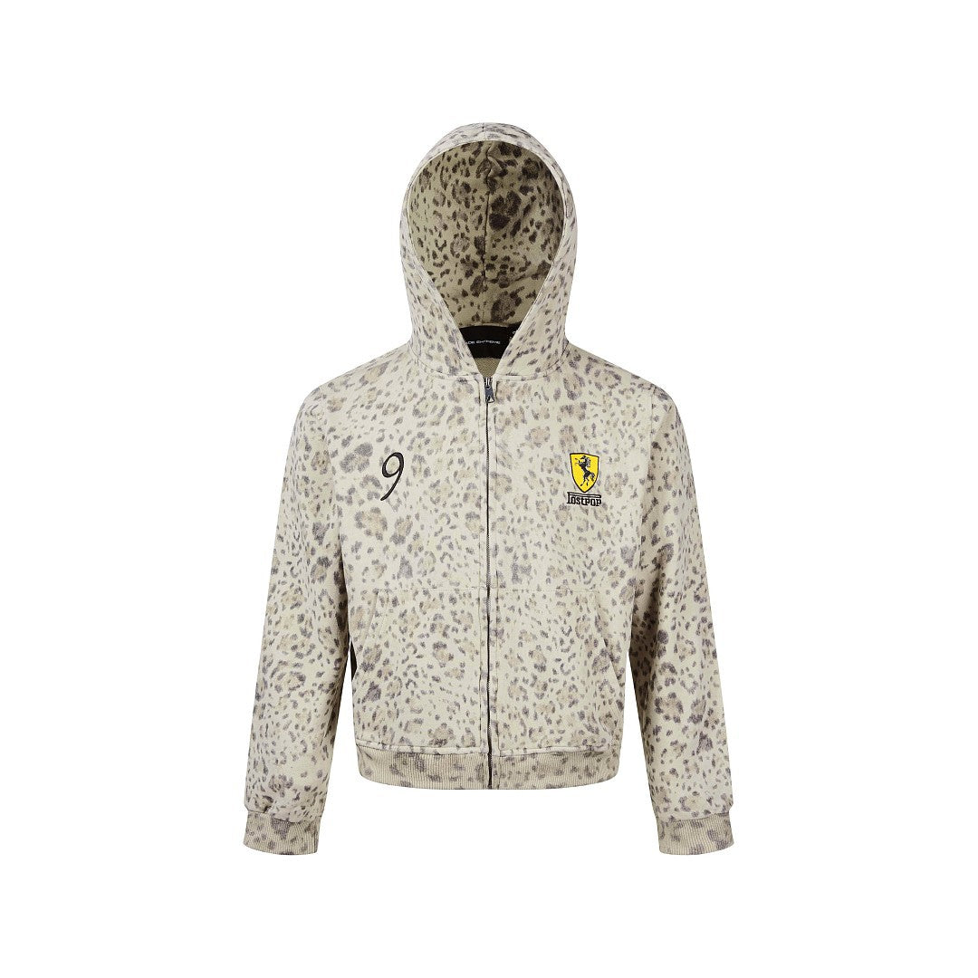 Front studio shot of a womens leopard print full-zip hoodie with chest embroidery on white backdrop.