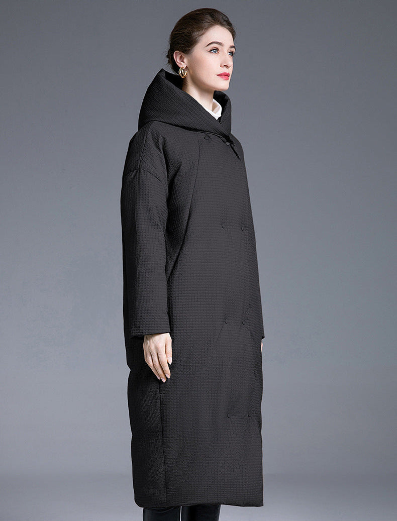 Black long puffer coat side view, hooded cocoon fit, over-knee