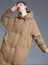 Camel womens long puffer coat, hooded, angled side view, quilted