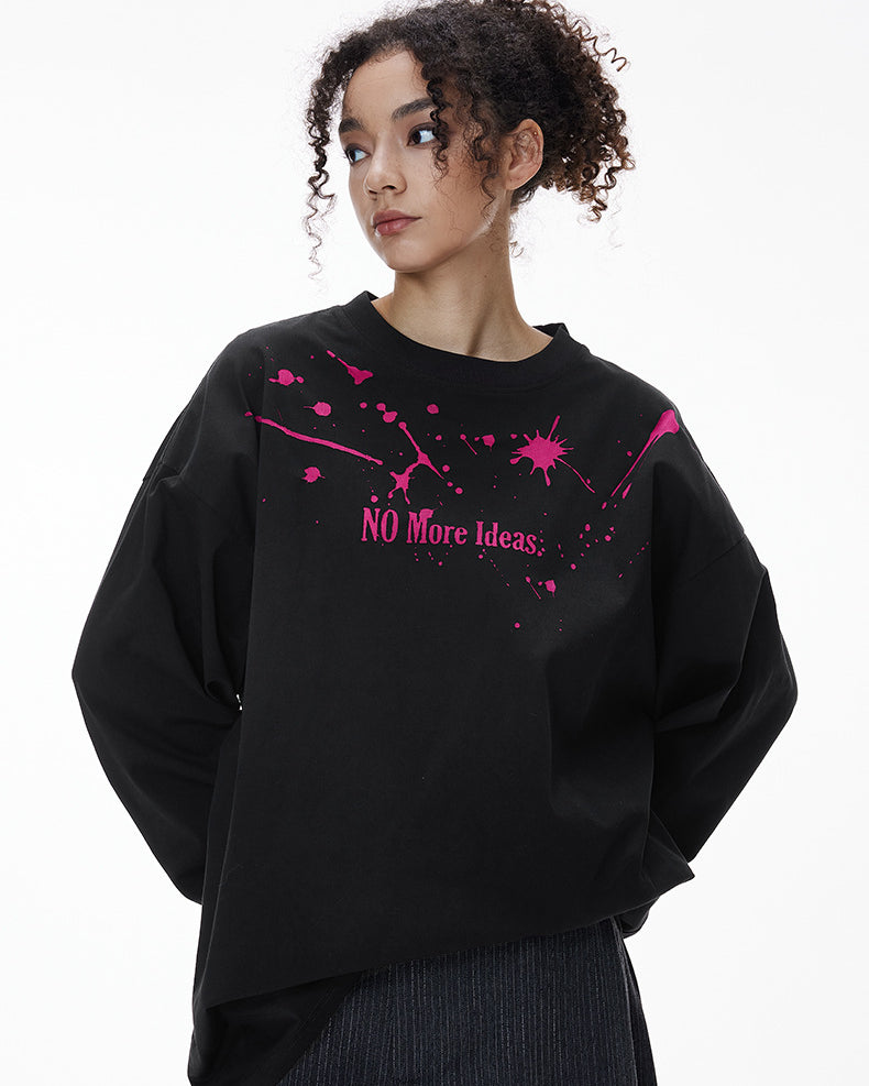Female model wearing black "NO More Ideas" long sleeve t-shirt with pink print