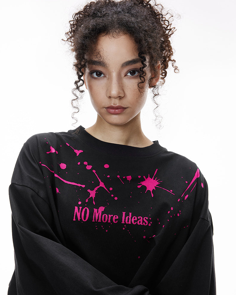 Woman front view black "NO More Ideas" oversized graphic long sleeve shirt