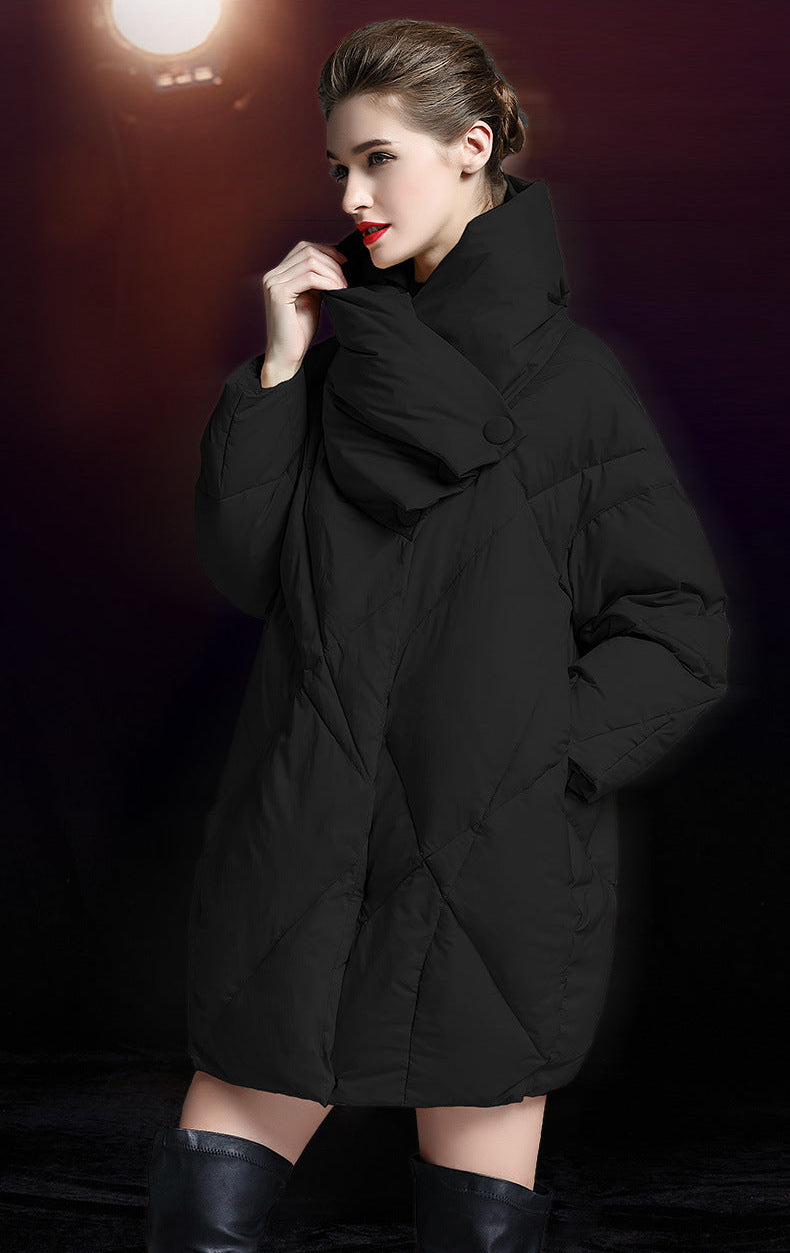 Side view of black down coat with high neck and hidden snap closure
