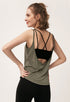 Side view of army green tank top showing open back and black strappy sports bra underneath.