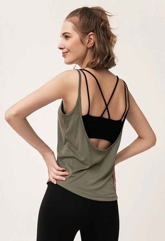 Side view of army green tank top showing open back and black strappy sports bra underneath.