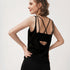 Back view of black tank top showing dark teal criss-cross sports bra.