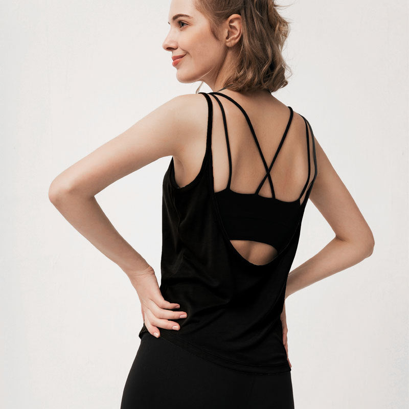 Back view of black tank top showing dark teal criss-cross sports bra.