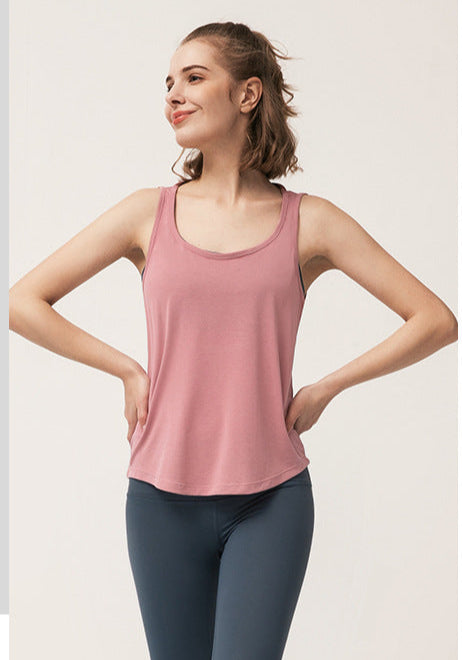 Side-by-side images of woman in dusty pink tank top, front and back views.