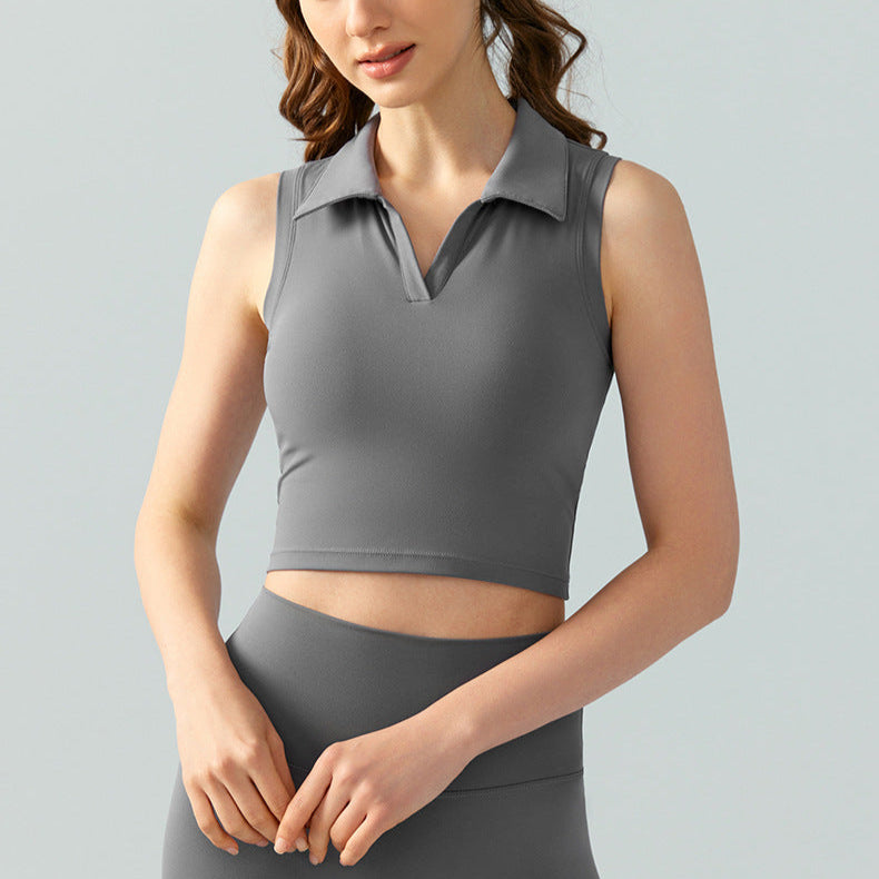 Women’s sleeveless polo golf top in gray with cropped fit and V-neck collar, angled front view