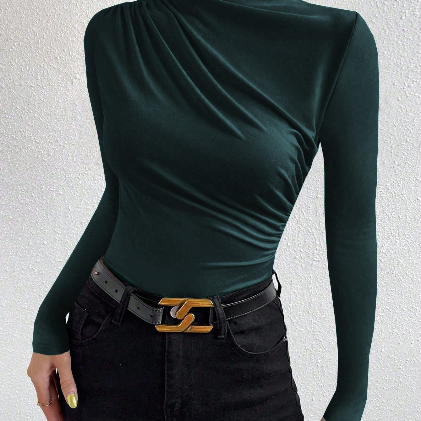 women’s slim fit ruched long sleeve top in green knit, draped crew neck, front three-quarter view with black jeans