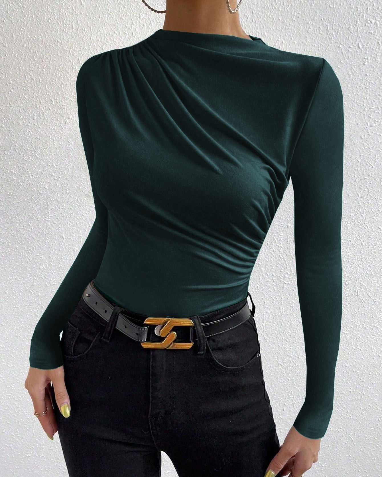 women’s slim fit ruched long sleeve top in green knit, draped crew neck, front three-quarter view with black jeans