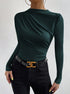 women’s slim fit ruched long sleeve top in green knit, draped crew neck, front three-quarter view with black jeans