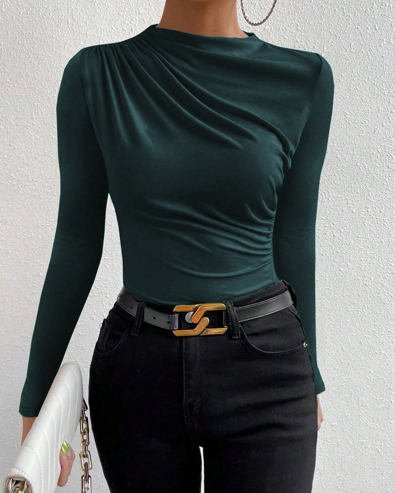 full front view, slim fit green ruched knit top with draped crew neck, styled with black belt