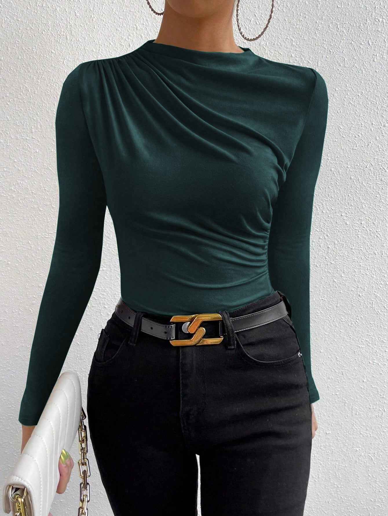 full front view, slim fit green ruched knit top with draped crew neck, styled with black belt