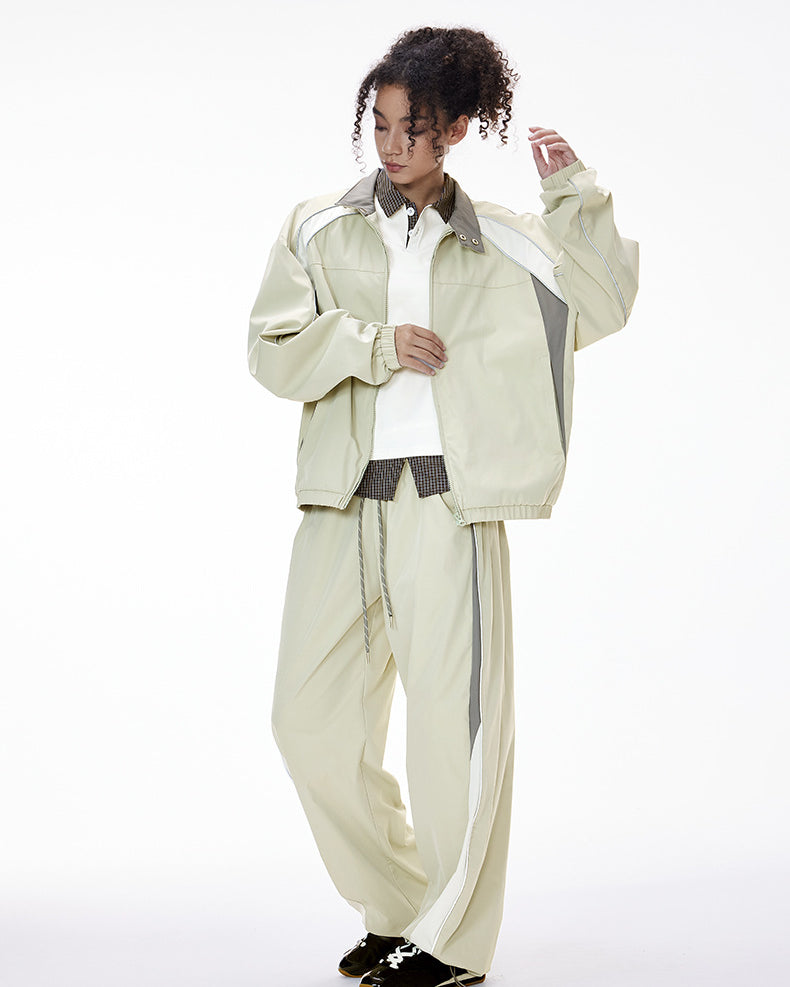 Light gray women’s tracksuit front view, racing jacket with women’s wide leg pants