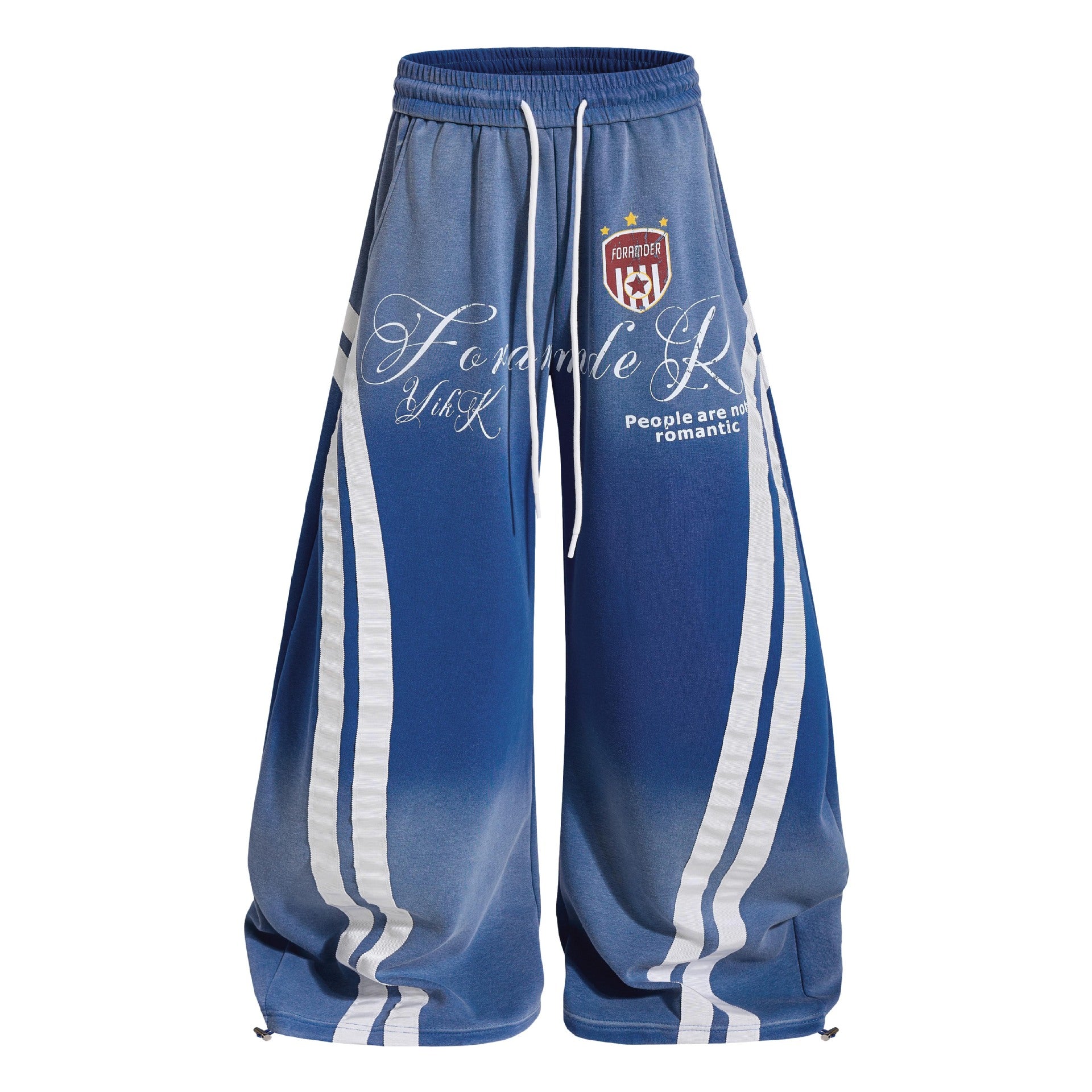 Product shot of washed blue gradient vintage baggy sweatpants featuring curved side stripes and toggle hem.