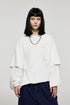 Women wearing oversized white long sleeve t-shirt with wide-leg pants