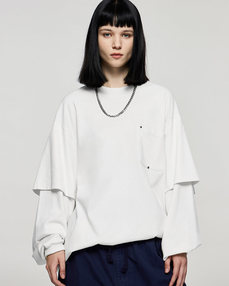 Women wearing oversized white long sleeve t-shirt with wide-leg pants