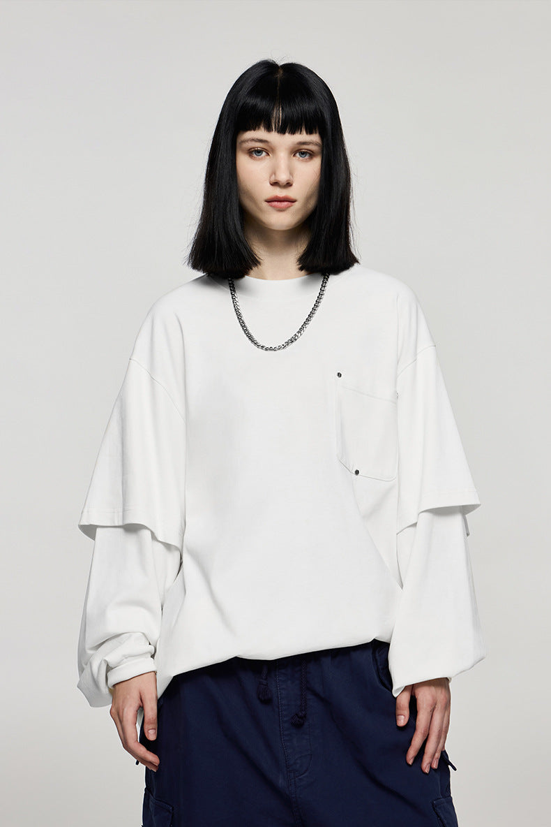 Women wearing oversized white long sleeve t-shirt with wide-leg pants