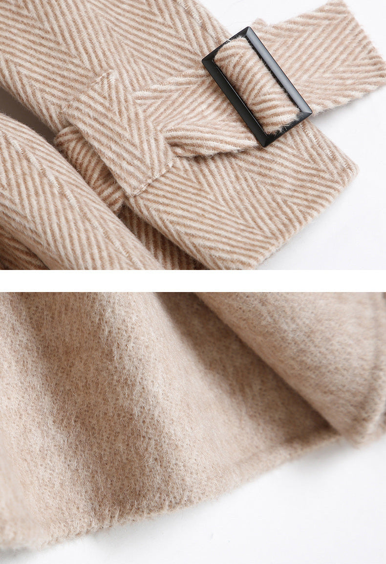 Belt knot and sleeve detail of beige wool coat
