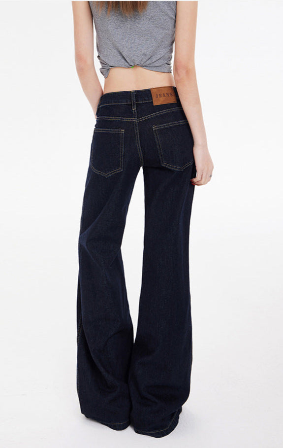 Back view of of flared jeans highlighting back yoke and label above pocket