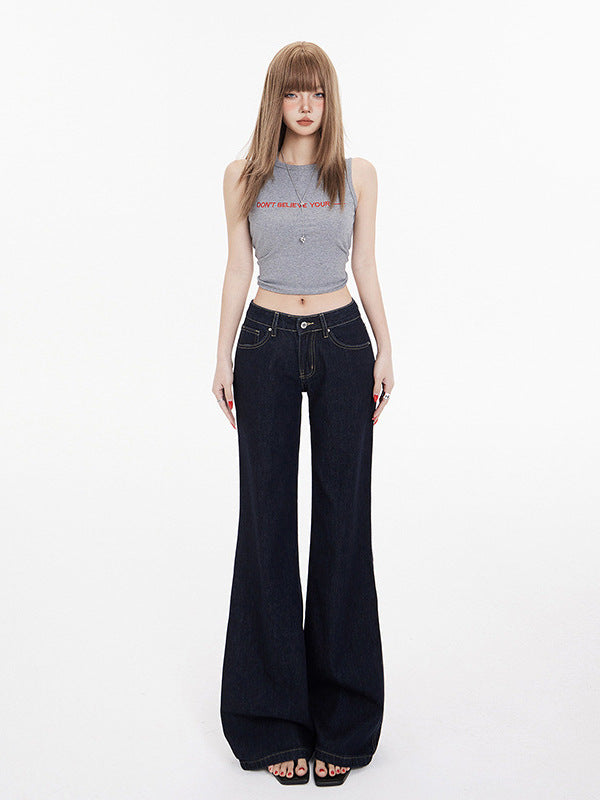 Front view of dark wash flared jeans with contrast stitching on female model